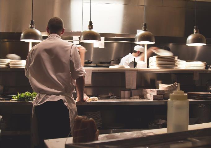 Staff operating in a commercial kitchen