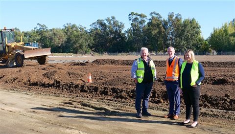 Politicians and contractor standing at the Churchill Park site