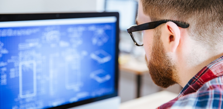 image of person looking at a design on the computer