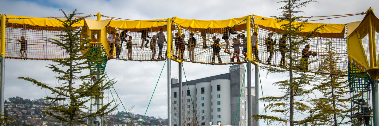 Bird eye view of Riverbend Park where children are climbing the play equipment