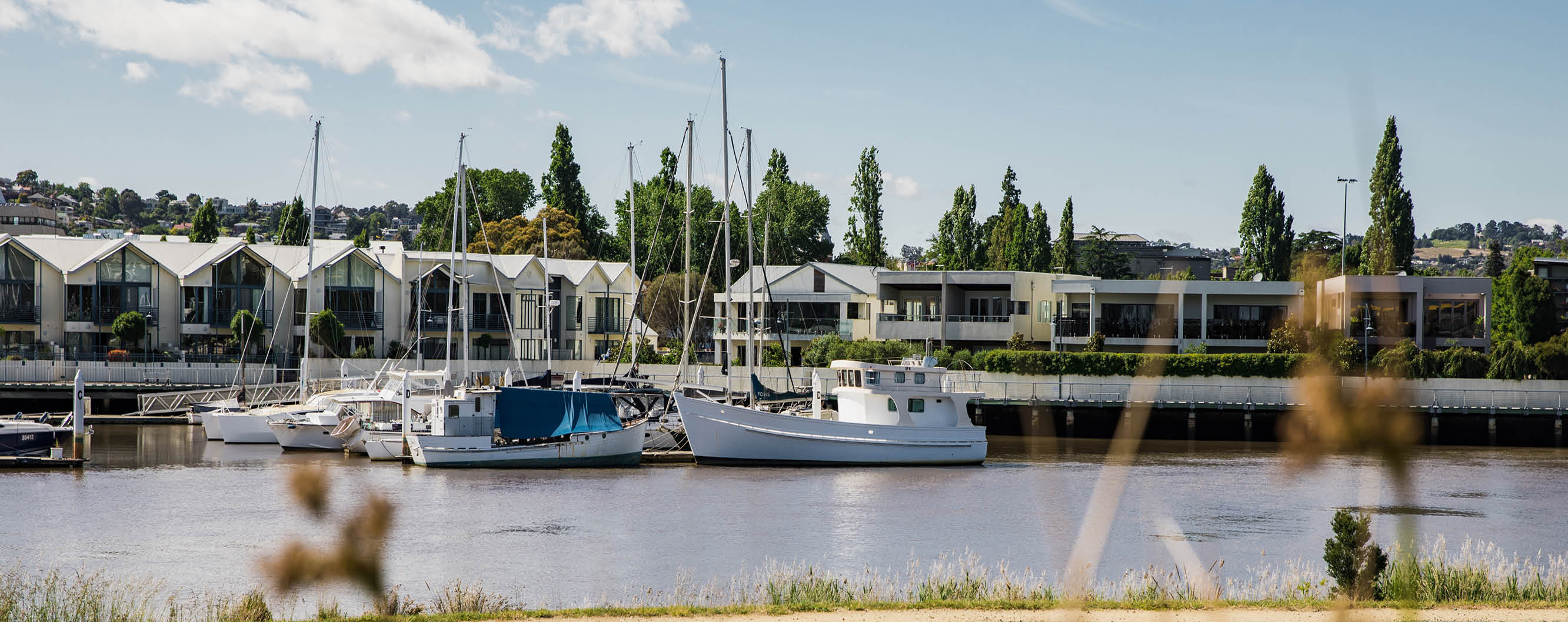 image of docked boats in the kanamaluka/tamar estuary